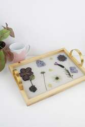 Floral Trays And Boards: Wooden trays with gold handles.