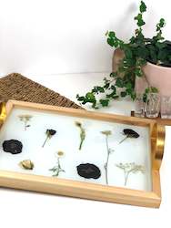 Wooden trays with gold handles.