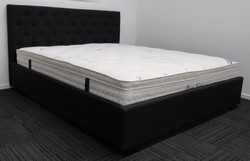 Queen black upholstered bed &. Pillow top mattress