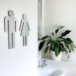 Brushed stainless steel toilet symbols